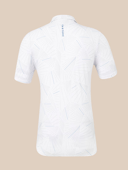 White short-sleeve polo shirt with a light blue geometric line pattern, shown from the back on a solid beige background. The brand name 'CASTORE' is printed vertically in blue on the upper back collar.