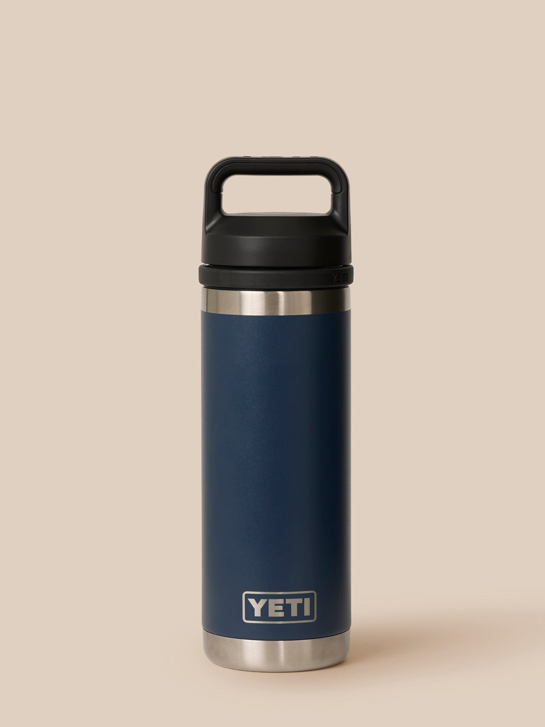 Close up of navy YETI Castore bottle top showing black leakproof cap with integrated handle
