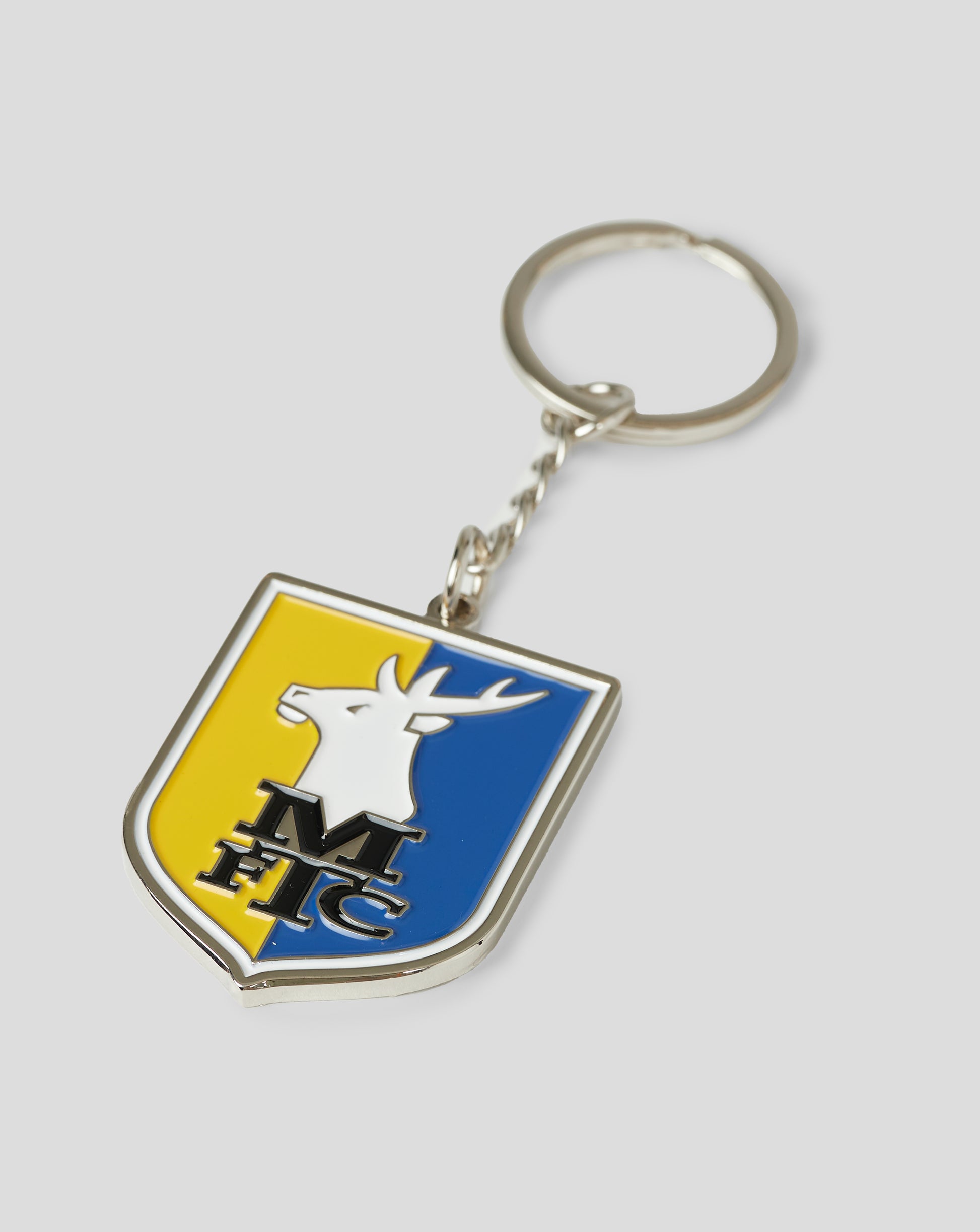 Close up of Mansfield Crest Keyring badge with yellow blue shield and white stag.