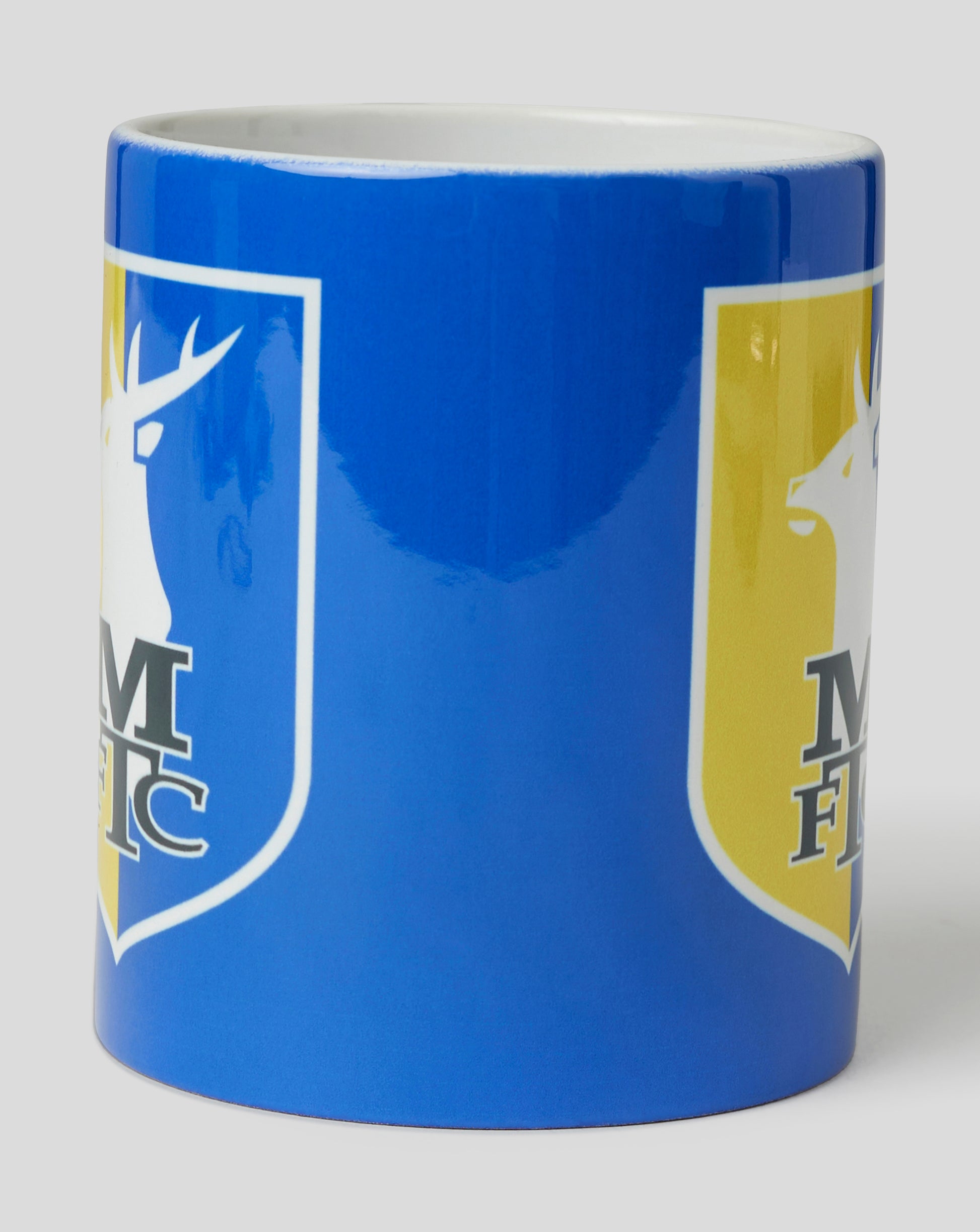 Mansfield Crest Mug close up showing front crest in blue and yellow.