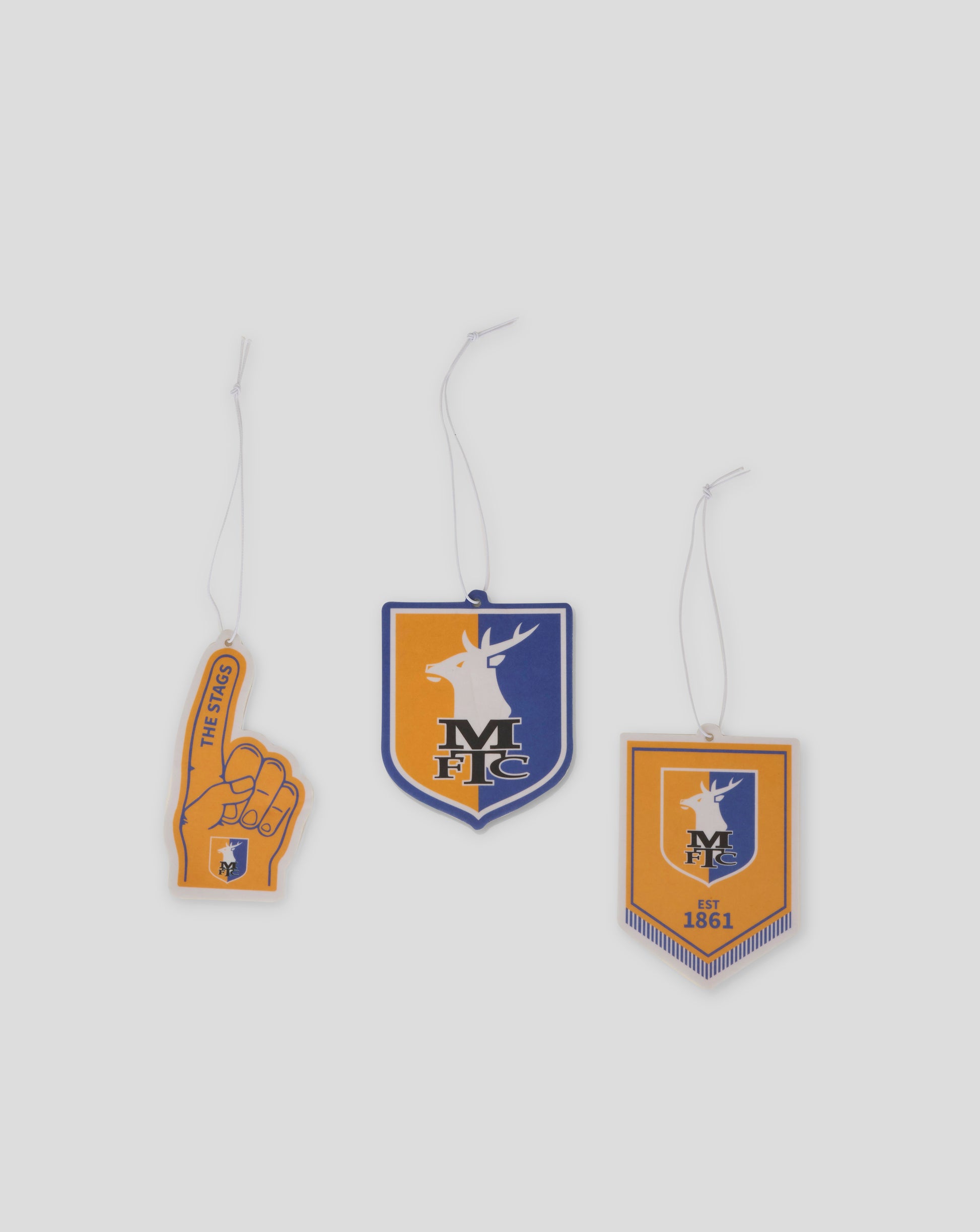 Three MTFC themed air fresheners on cords featuring a foam finger tag a shield crest and a rectangular emblem