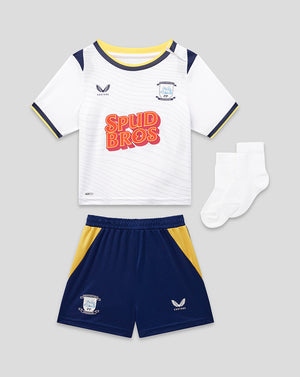 Children's sports outfit with white jersey, navy shorts, and socks on a gray background
