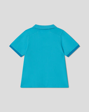 Blue polo shirt on a light gray background