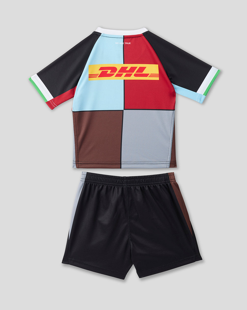 Harlequins 2026/27 home infant kit laid flat showing color block shirt with DHL sponsor and matching black shorts