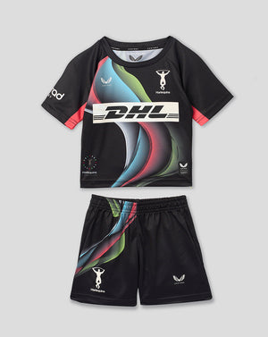 A kids' two-piece athletic set consisting of a black short-sleeve jersey and matching shorts, featuring a vibrant multicolor graphic print on the front and sides, with white logos including DHL. The set is displayed flat against a neutral gray background.