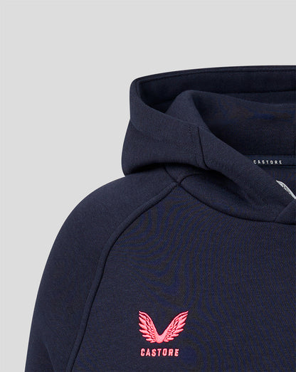 Close up of navy hoodie displaying pink Harlequins crest and Castore label at the neckline