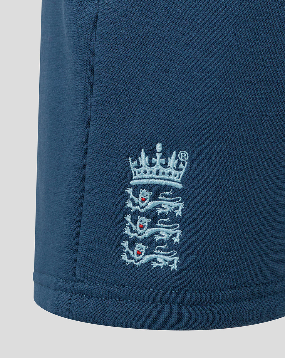Navy blue fabric with embroidered emblem on a light gray background