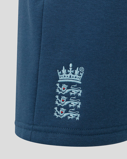 Navy blue fabric with embroidered emblem on a light gray background