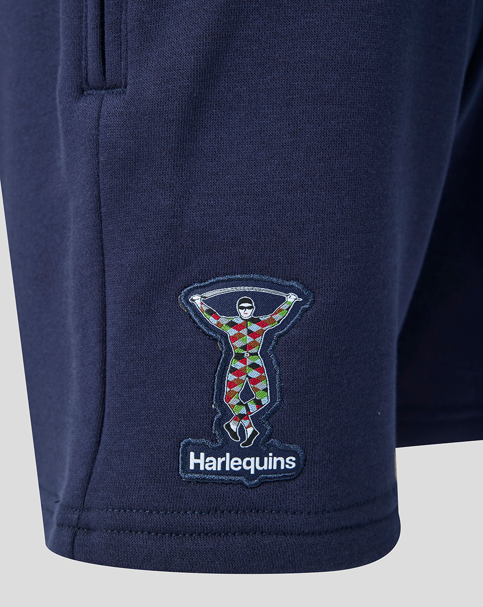 Navy blue shorts with Harlequins logo on a light gray background