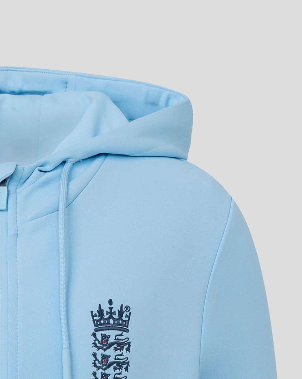 Light blue hoodie with a logo on the sleeve against a light gray background