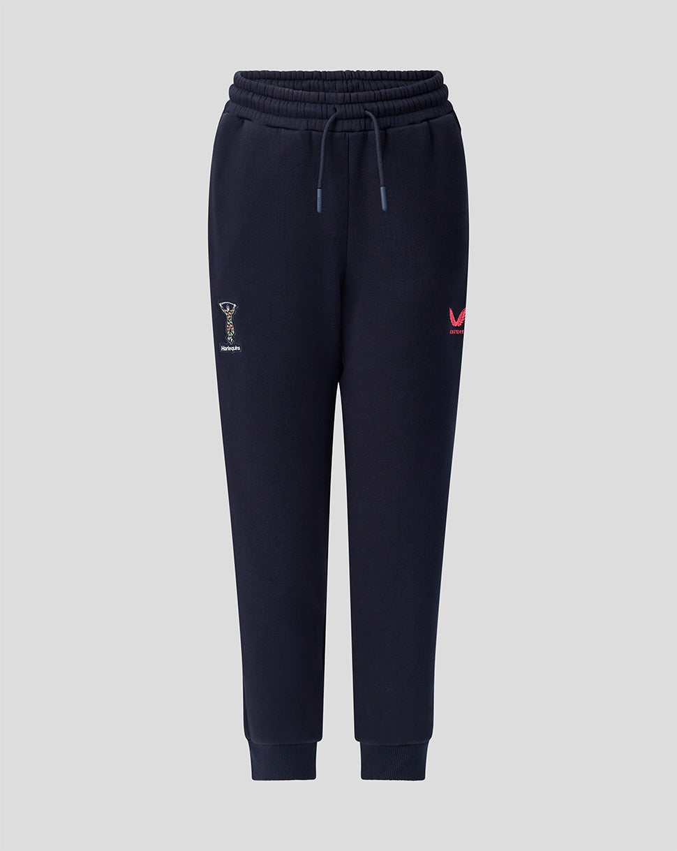 Navy Harlequins junior 2026/27 travel joggers with crest on thigh and Castore branding.