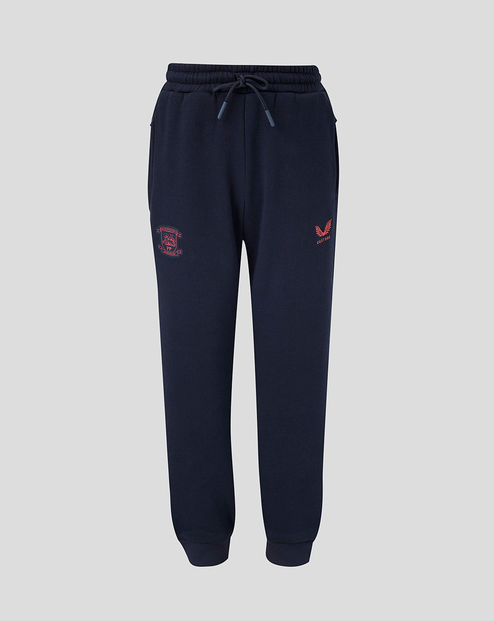 Navy blue jogger pants with red logo on a light gray background