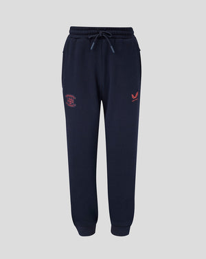 Navy blue jogger pants with red logo on a light gray background