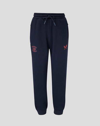 Navy blue jogger pants with red logo on a light gray background