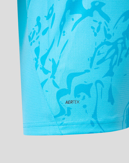 Close-up of a blue athletic shirt with abstract patterns and 'AERTEK' branding on a light gray background.