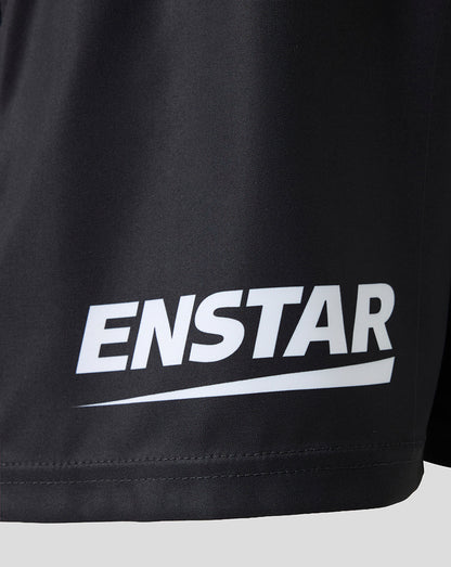 Close-up of a black athletic garment, likely shorts, featuring a bold white 'ENSTAR' logo printed across the lower front.
