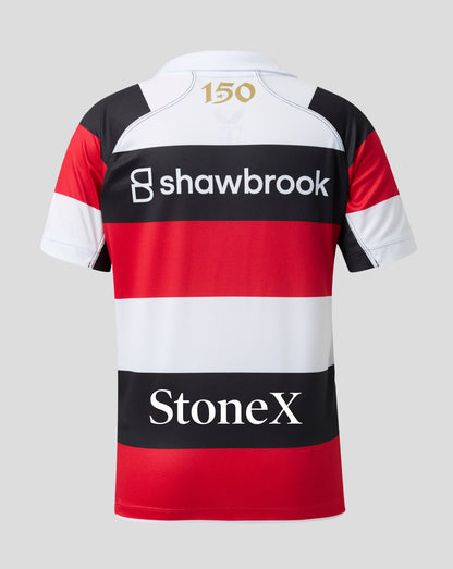 The back of a short-sleeve rugby jersey featuring horizontal red, white, and black stripes, with 'shawbrook' and 'StoneX' sponsor logos printed in white on the black bands, and a gold '150' on the white collar.