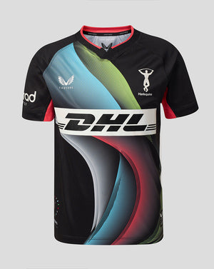 A short-sleeve athletic jersey with a black base and bold abstract wave graphics in light blue, green, red, and gray. The jersey features a large white DHL logo across the chest, a white Castore logo on the right chest, and a white Harlequins logo on the left chest, set against a solid light gray background.
