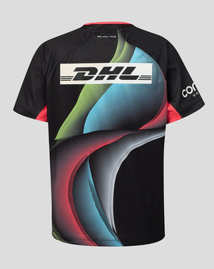A black short-sleeve athletic jersey with a colorful abstract wave pattern in blue, green, and red, featuring a large white DHL logo across the chest and a white' logo on the sleeve, shown against a solid gray background.