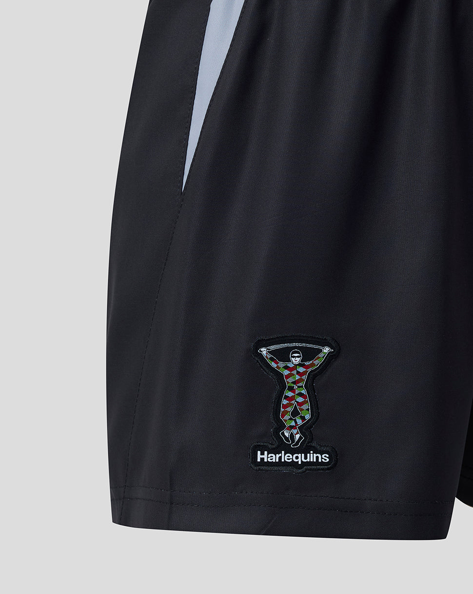Harlequins junior home shorts close up showing the crest patch on the leg