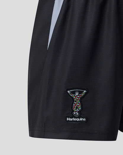 Harlequins junior home shorts close up showing the crest patch on the leg