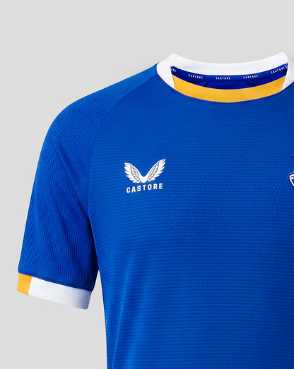 Blue Everton FC junior home short sleeve shirt close up of chest with Castore logo and white collar with yellow trim.