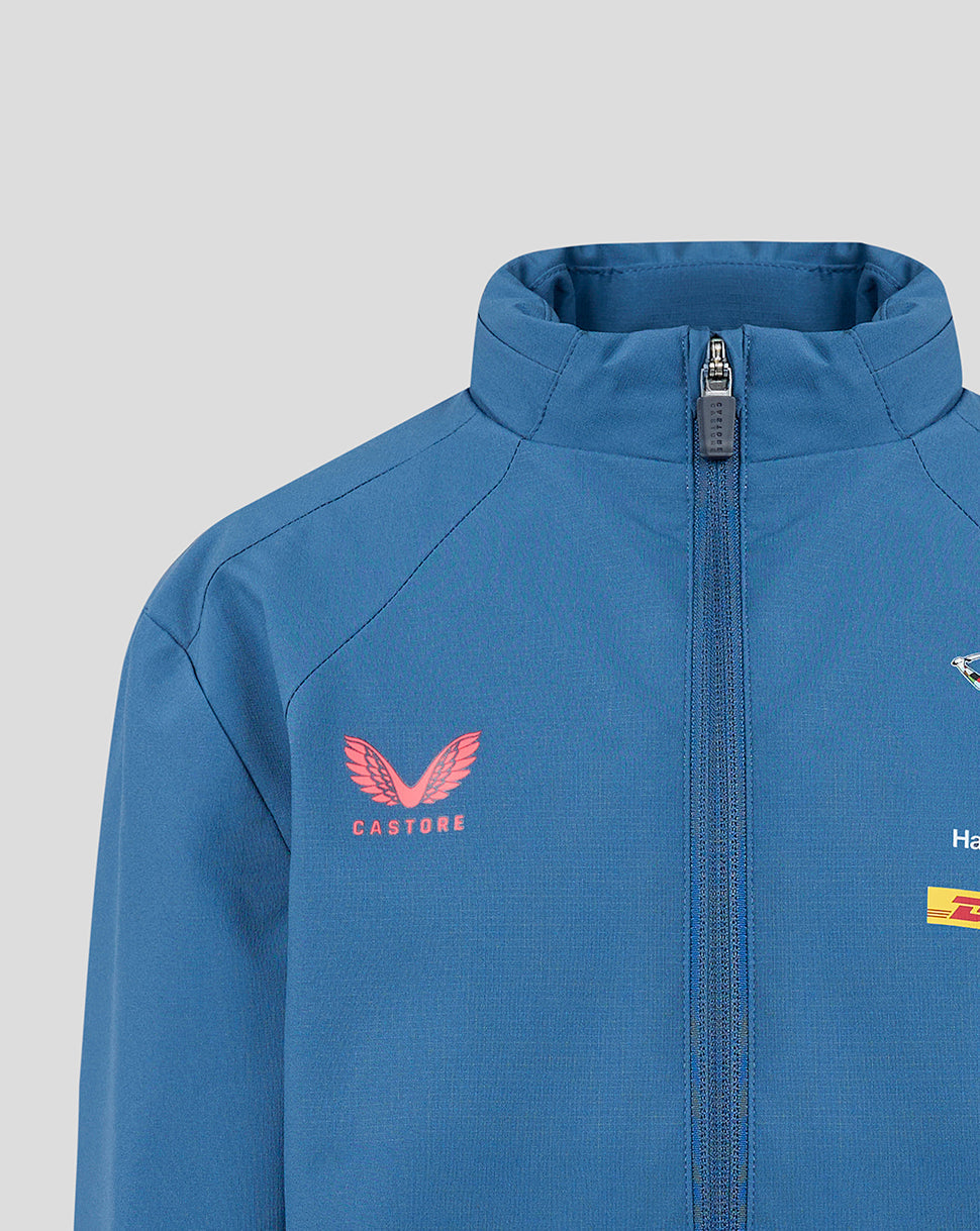 Blue jacket with a red logo on a gray background