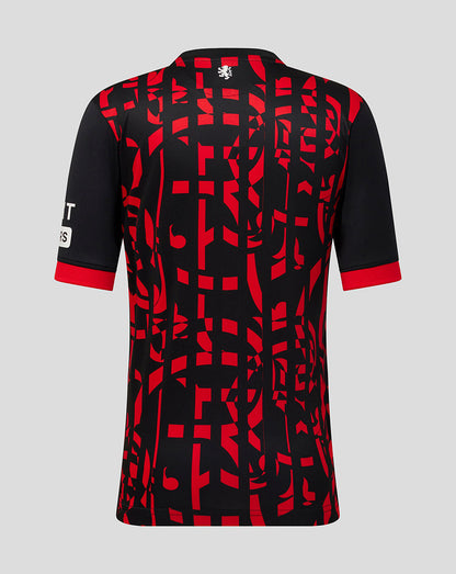 A short-sleeve athletic jersey shown from the back, featuring a black base with a bold red abstract geometric pattern and red trim at the collar and sleeve cuffs, set against a solid light gray background.
