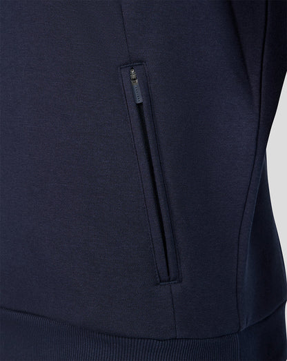 Close-up of navy Harlequins Travel Sweatshirt with zippered side pocket.