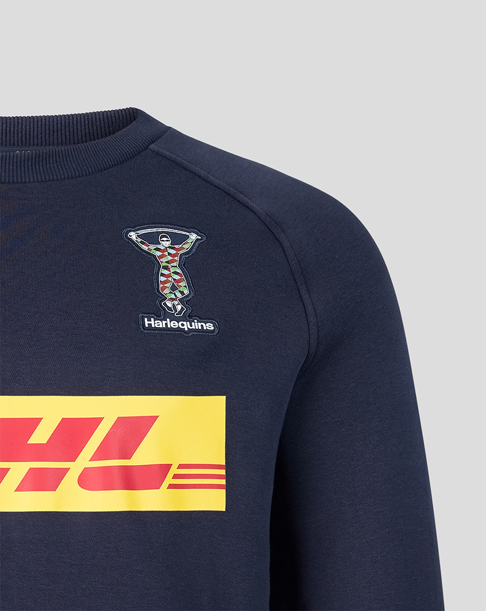 Shoulder and chest of navy Harlequins sweatshirt featuring a small Castore emblem and a large DHL graphic