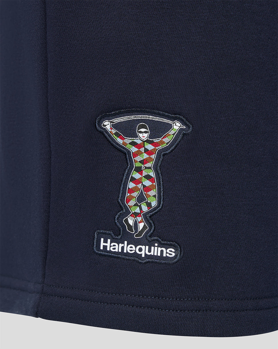 Harlequins logo patch on navy fabric of men's travel shorts
