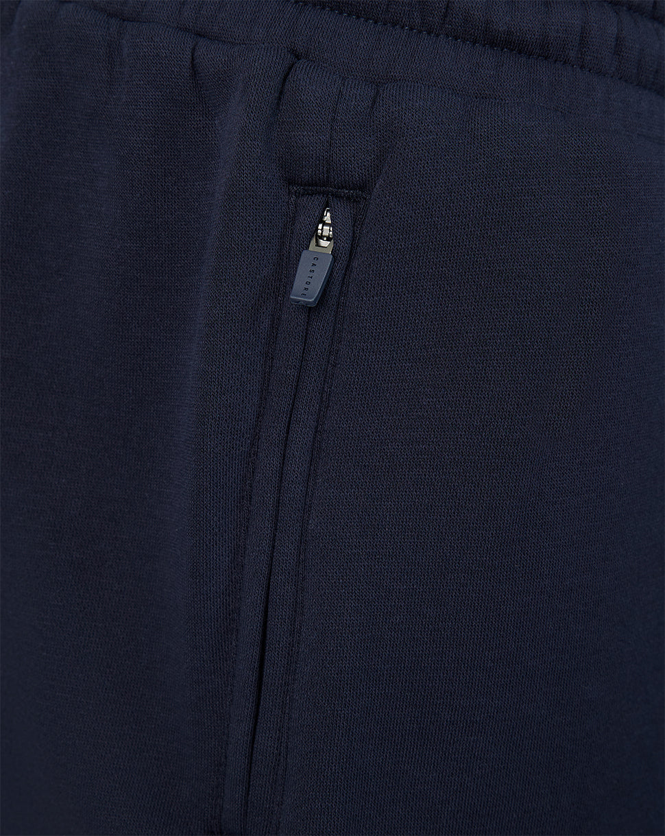 Close up of navy shorts side zip pocket with Castore zipper pull
