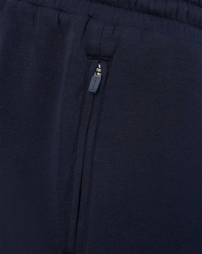 Close up of navy shorts side zip pocket with Castore zipper pull
