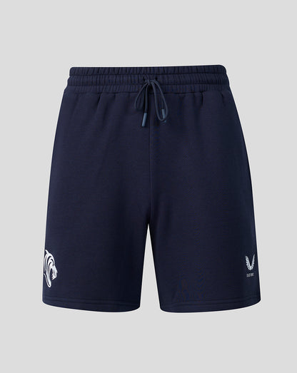 Front view of navy Leicester Tigers travel shorts with a drawstring waistband and white logo at the hem.