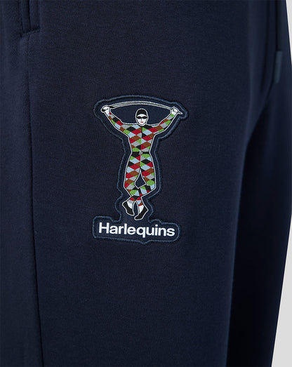 Navy jogger leg with a multicolor Harlequins emblem patch and logo beneath