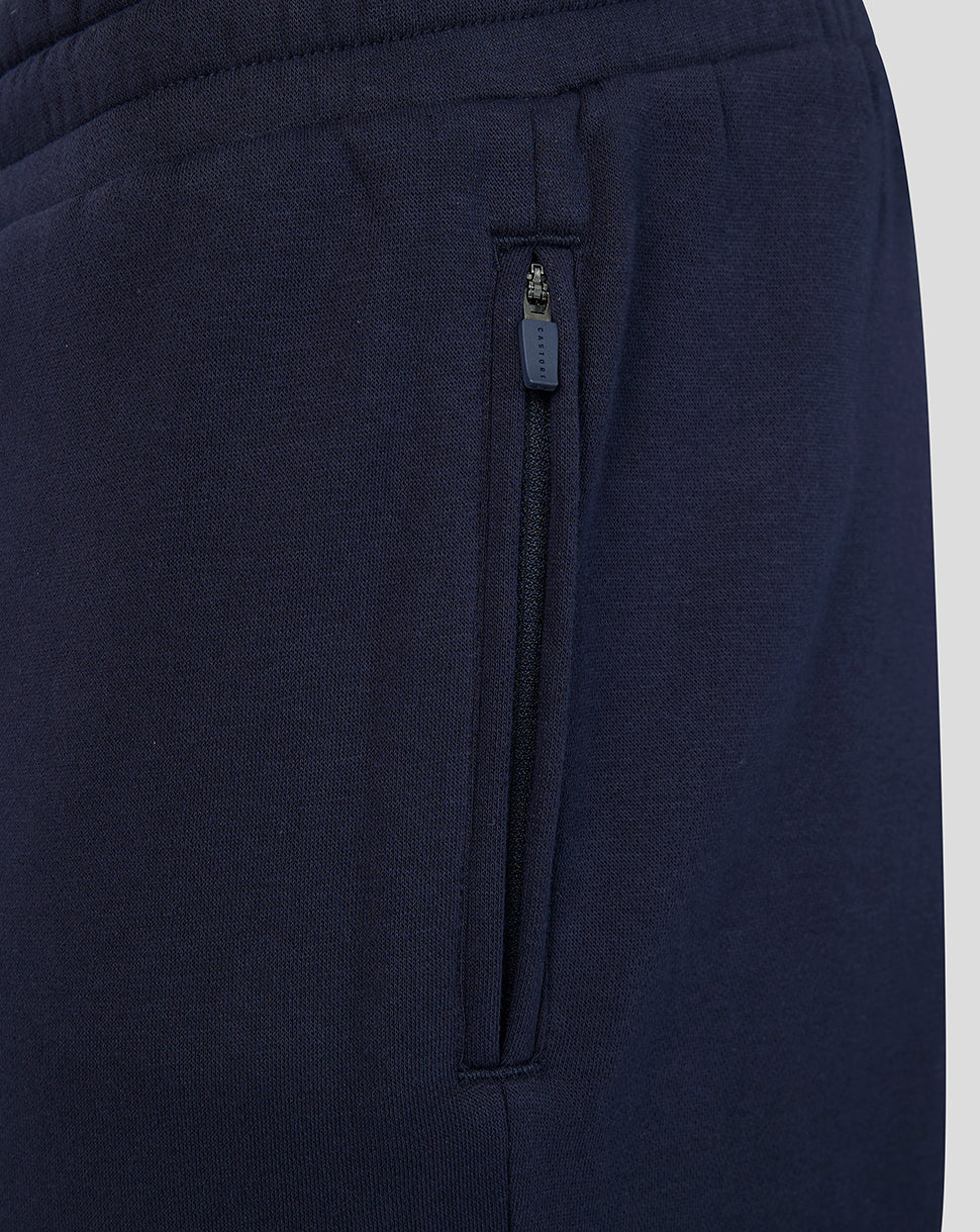 Navy joggers side pocket with a vertical zipper and Castore pull.