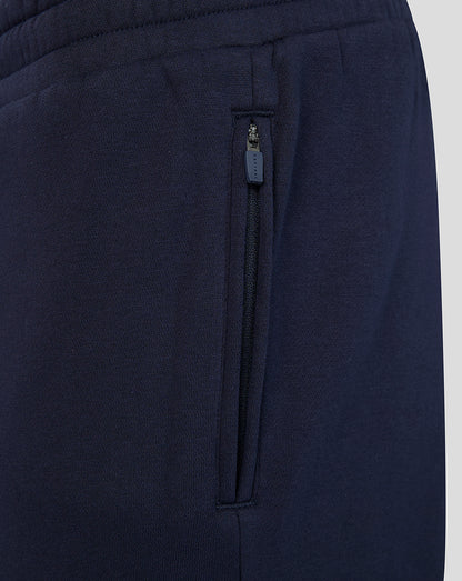 Navy joggers side pocket with a vertical zipper and Castore pull.