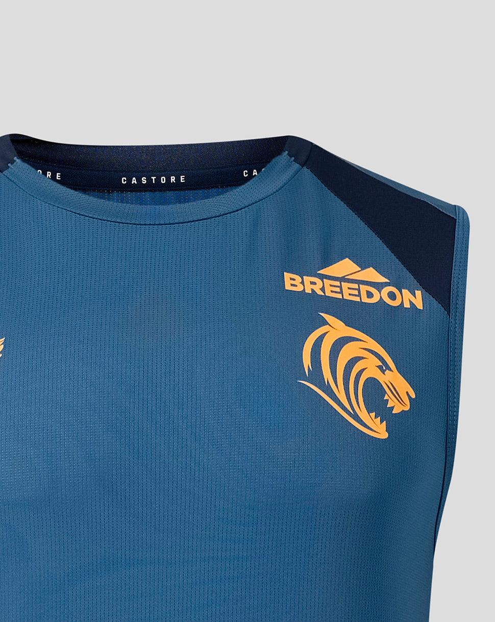 Close-up of blue training vest shoulder and chest with BREEDON logo and dark panel