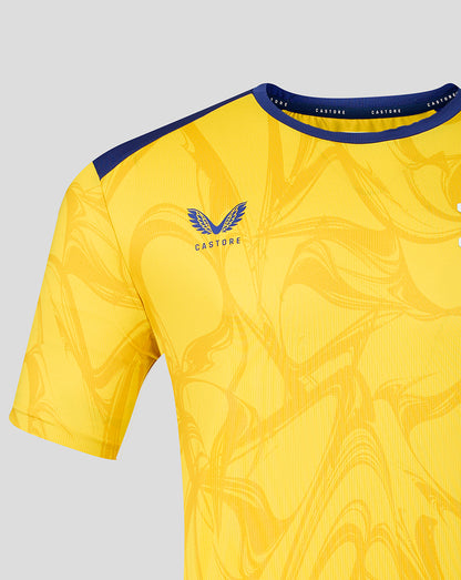 Shoulder and chest area of yellow Preston North End jersey with blue shoulder panel and crest
