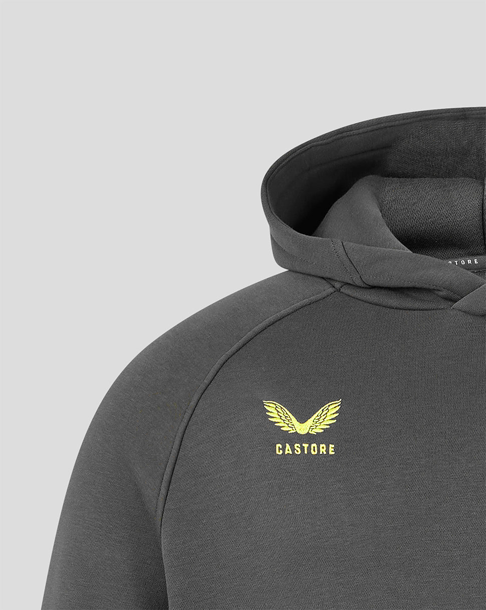 Close-up of a dark gray hooded sweatshirt with a yellow winged logo and the word 'CASTORE' printed on the chest, shown against a light gray background.