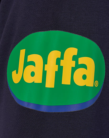 Prominent Jaffa logo patch in green and yellow on dark navy fabric.