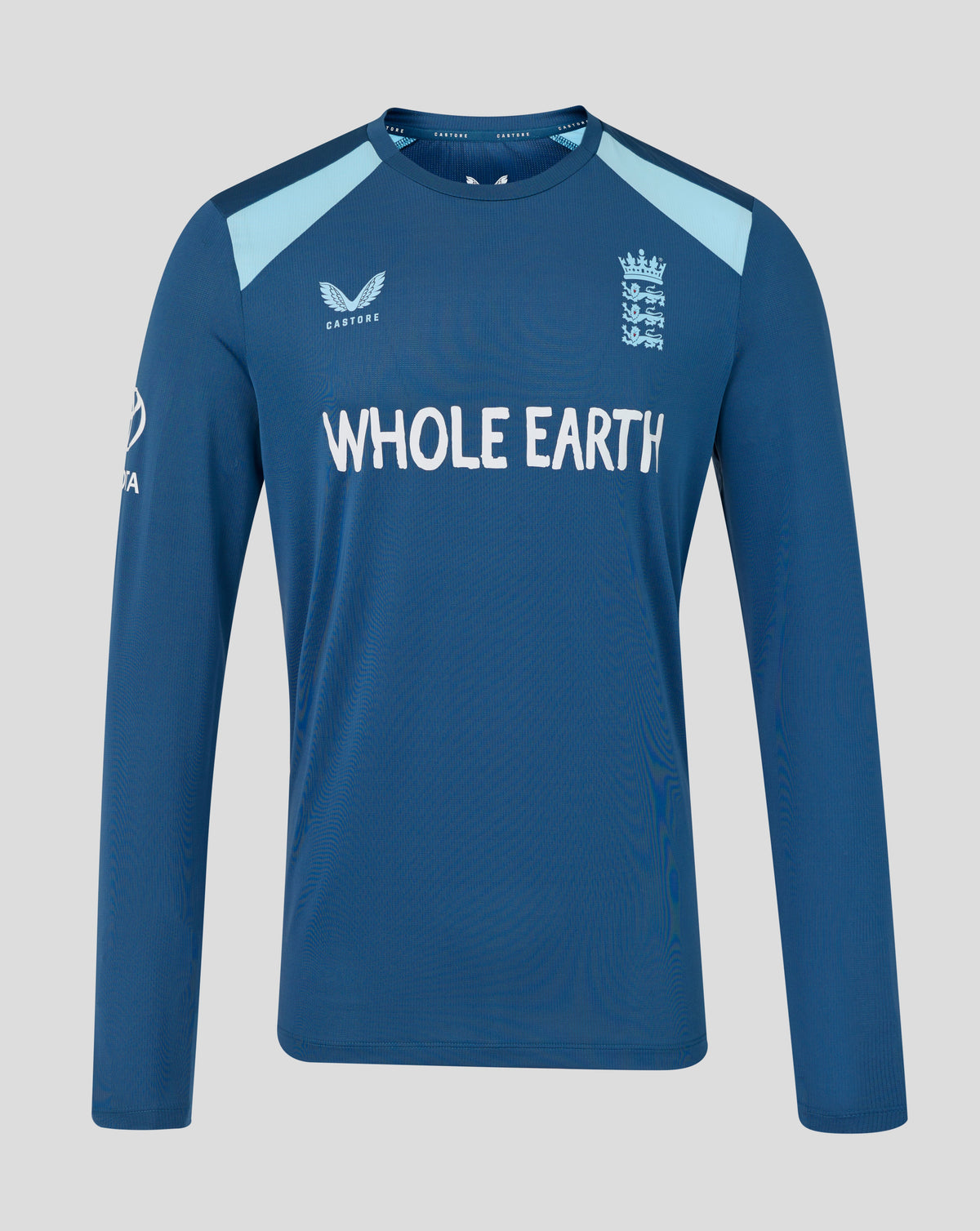 Blue long-sleeve shirt with 'Whole Earth' branding on a gray background