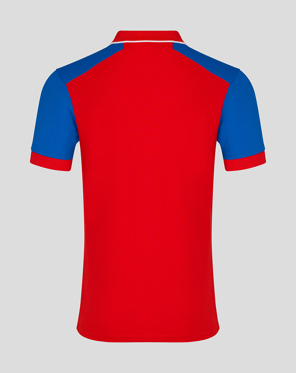 Back view of England Cricket short sleeve shirt in bold red with blue shoulder panels and white collar trim