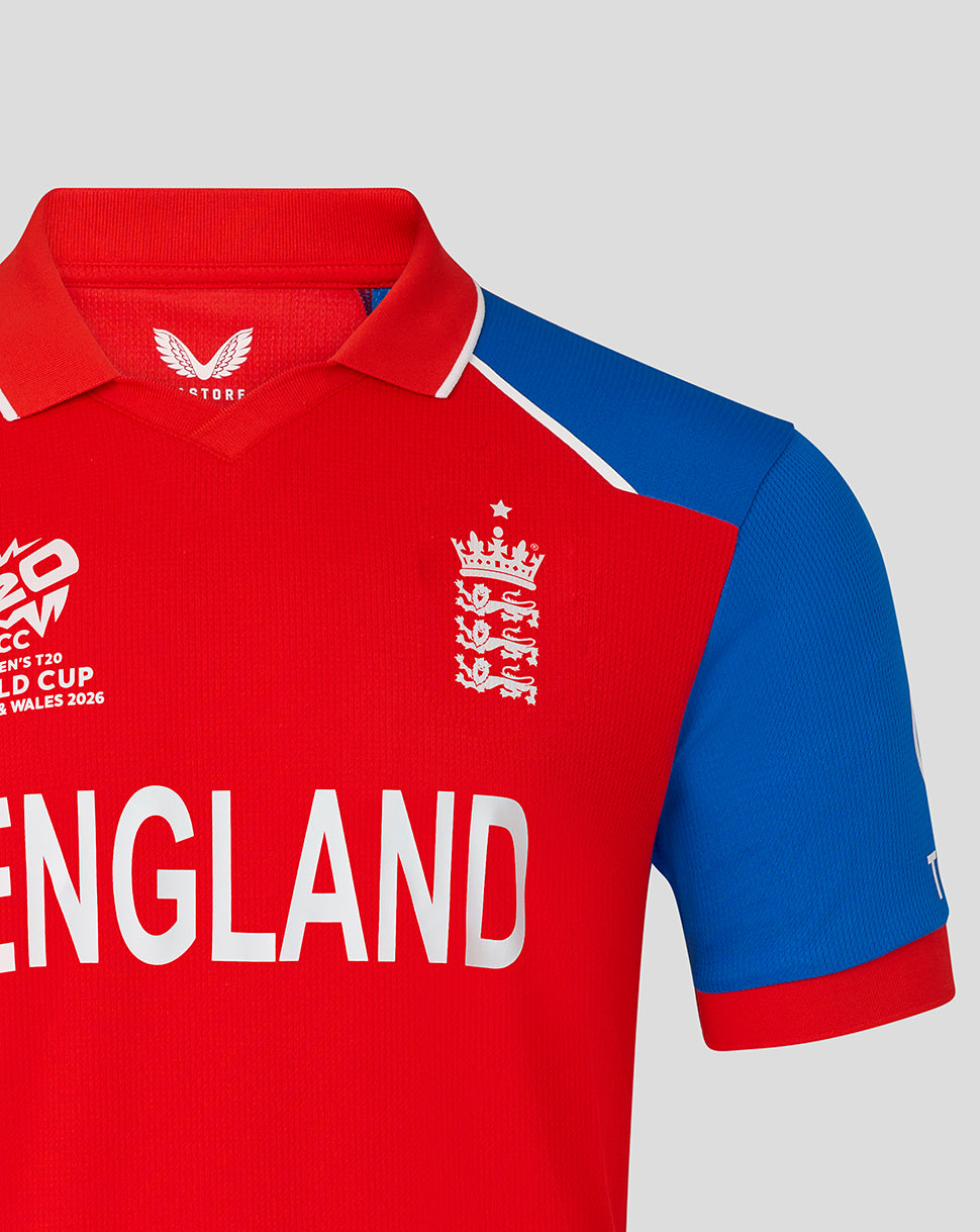 England cricket replica shirt in red with bold ENGLAND lettering and crest on the chest against a blue sleeve.
