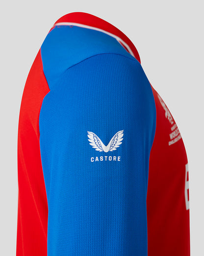 Red and blue sports jersey with Castore logo on a gray background