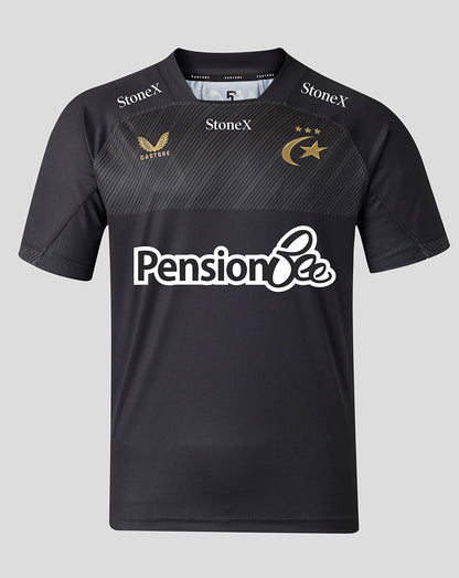 A black short-sleeve sports jersey with a subtle diagonal textured pattern across the chest. It features the white 'Pension Bee' sponsor logo across the center, 'StoneX' branding on the shoulders, and gold embroidered logos for 'Castore' and the Saracens club emblem on the chest.