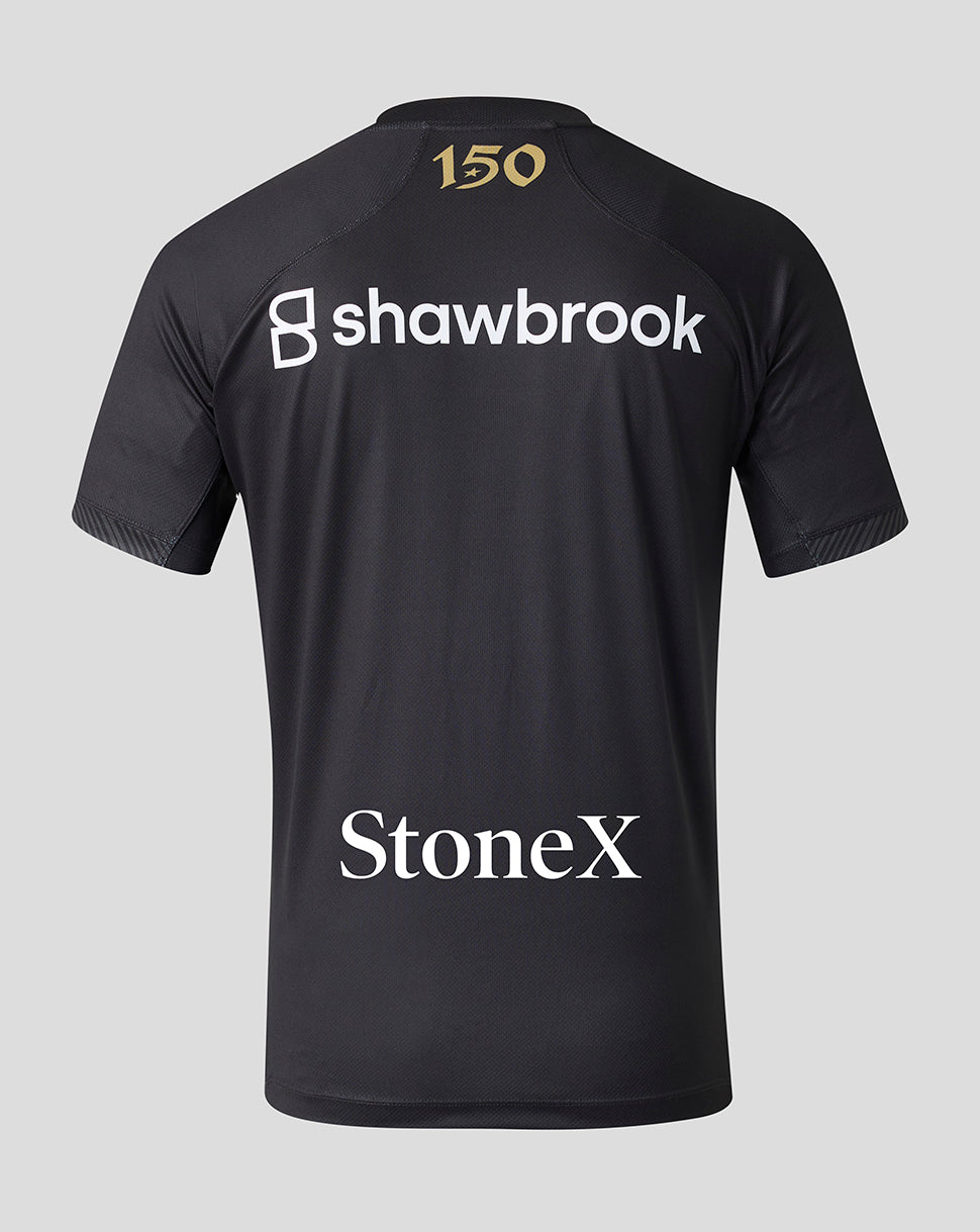 Black short-sleeve athletic jersey shown from the back, featuring a gold '150' print on the neck, a large white 'shawbrook' logo across the upper back, and 'StoneX' in white near the lower back, set against a solid light gray background.