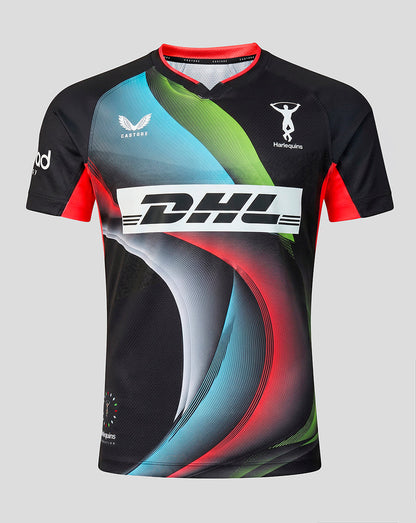 A short-sleeve athletic jersey with a black base and vibrant abstract wave patterns in blue, green, and red. It features a large white DHL logo across the chest, a white CASTORE logo on the right chest, and a white HARLEQUINS logo on the left chest, set against a solid light gray background.