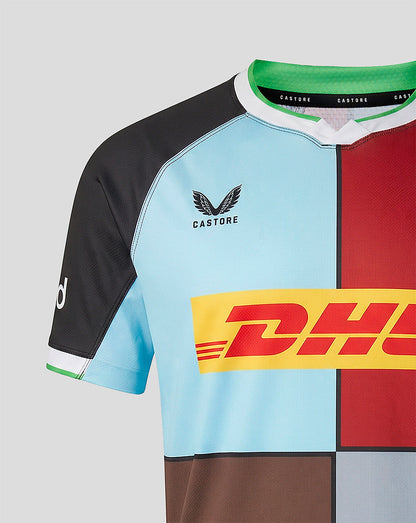 Close-up back shoulder of Harlequins 2026/27 home shirt showing blue and red panels and Castore neck branding