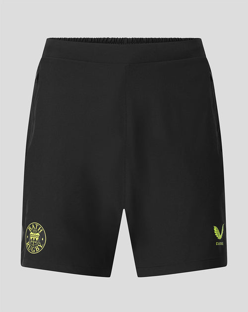 Black athletic shorts with yellow-green logo prints on the left and right legs, displayed against a neutral gray background.